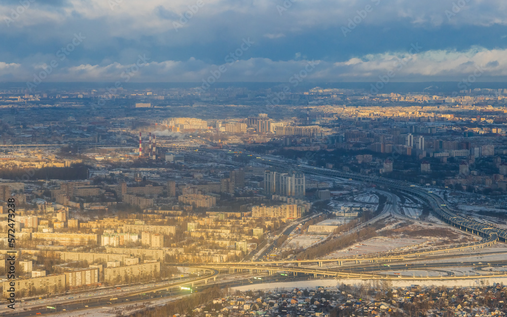 Aerial view of a big city. Top view of city blocks and highways. Cloudy weather. Saint-Petersburg, Russia.
