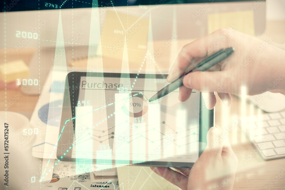 Double exposure of man's hands holding and using a phone and financial chart drawing. Market analysis concept. Double exposure of man's hands holding and using a phone and financial chart drawing. Market analysis concept.