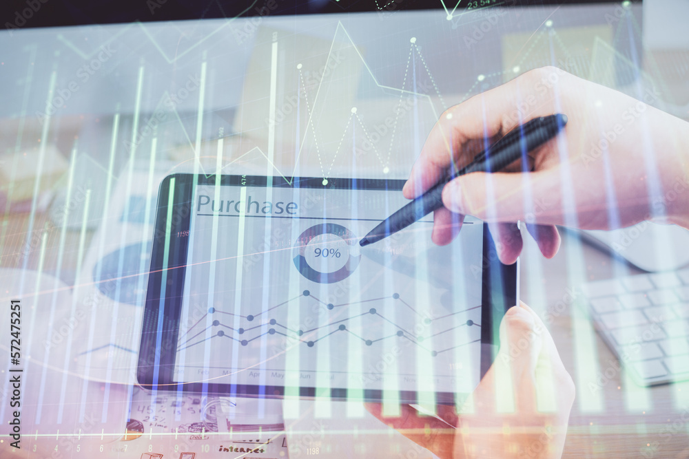 Double exposure of man's hands holding and using a phone and financial chart drawing. Market analysis concept. Double exposure of man's hands holding and using a phone and financial chart drawing. Market analysis concept.