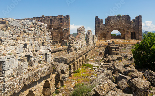 View of the ancient ruins of the roman bazilica and nymphaeum in the antiquity city of Aspendos, currently located near ..Antalya in the Serik district, Turkey