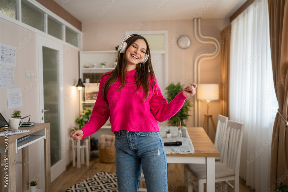 One young woman caucasian dance with headphones at home listen music One young woman caucasian dance with headphones at home listen music