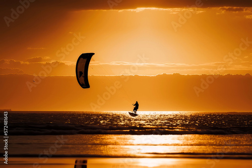 kitesurfing with golden silhouette, ai