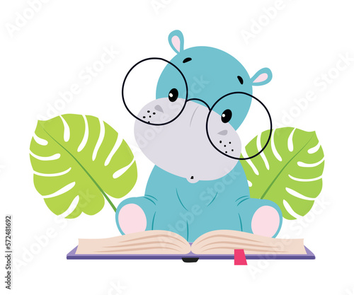 Cute baby hippo reading book. Funny smart wild African animal character in glasses sitting with book cartoon vector illustration