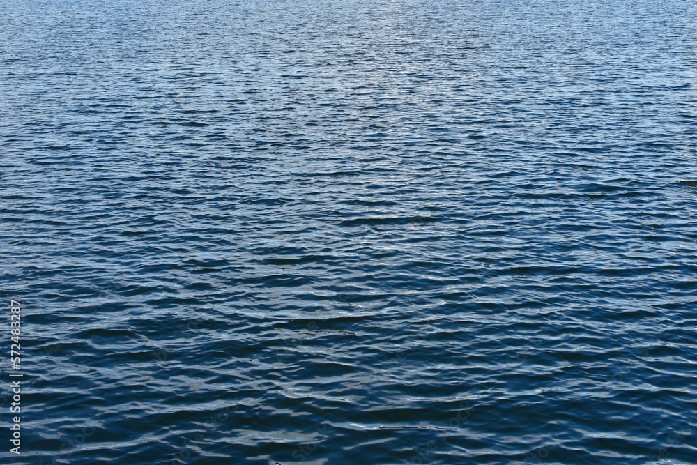 Background of calm blue water. Background of calm blue water.