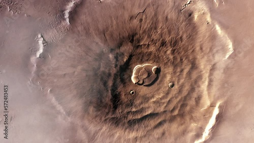 Olympus Mons on Planet Mars, the Largest Volcano in the Solar System with a Height of over 21.9 km (two and a half times the height of Mount Everest). Elements of this Video furnished by NASA. photo