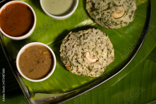 Fresh, savory rice cakes are a popular dish (known as  known as 'rava idli') from southern India and especially the Indian state Karnataka, served alongside sauces. photo