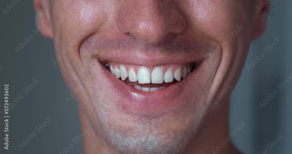 Smile of handsome man with perfect white teeth close up. Perfect white teeth and smile. Smile of handsome man with perfect white teeth close up. Perfect white teeth and smile.