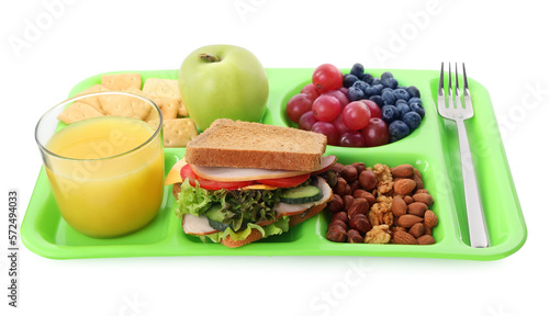 Tray with tasty food and juice on white background. School lunch