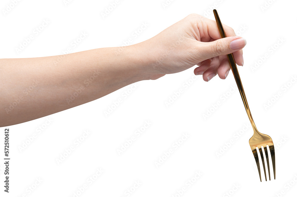 isolated of a woman's hand holding a golden fork.