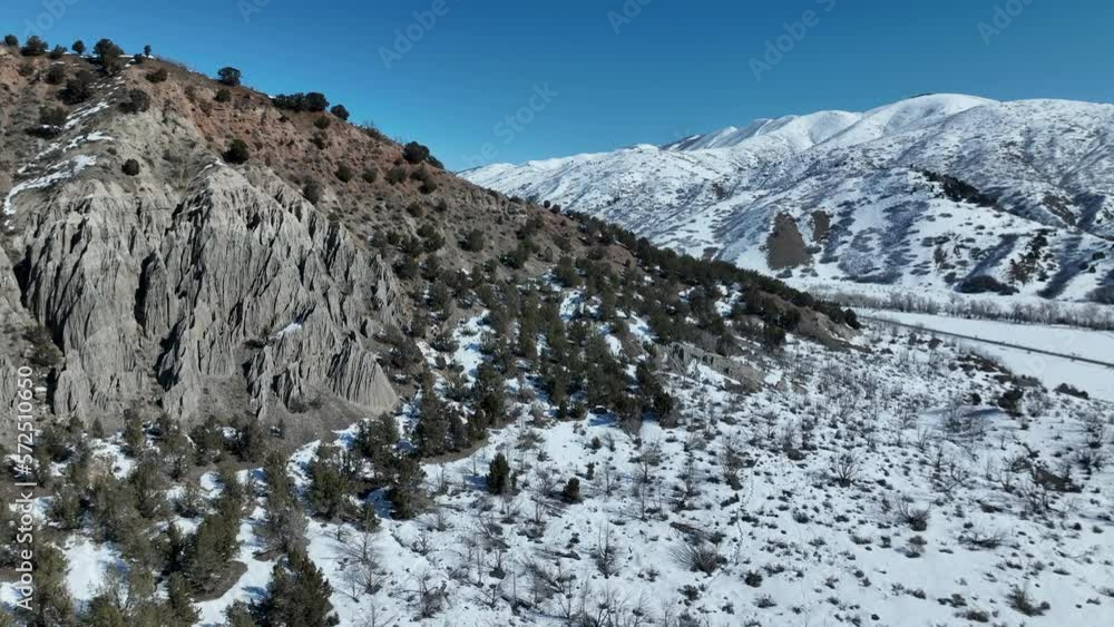 Aerial canyon erosion mountain canyon winter snow. Nebo Scenic Byway, Utah, national beauty and nature. Beautiful season winter snow. Erosion of rocks and steep landscape. Travel destination. Aerial canyon erosion mountain canyon winter snow. Nebo Scenic Byway, Utah, national beauty and nature. Beautiful season winter snow. Erosion of rocks and steep landscape. Travel destination.