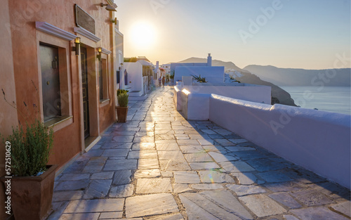 sunrise by the ocean of Oia Santorini Greece, a traditional Greek village in Santorini.  photo