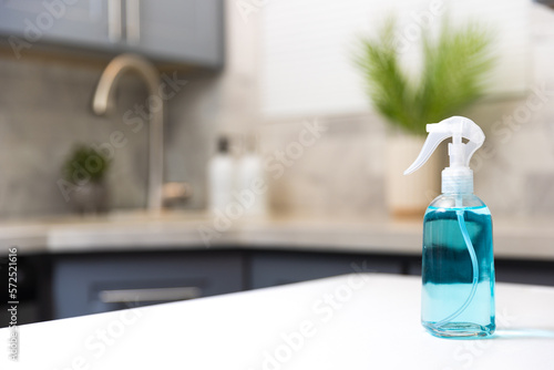 Cleaning  spray in a kitchen photo