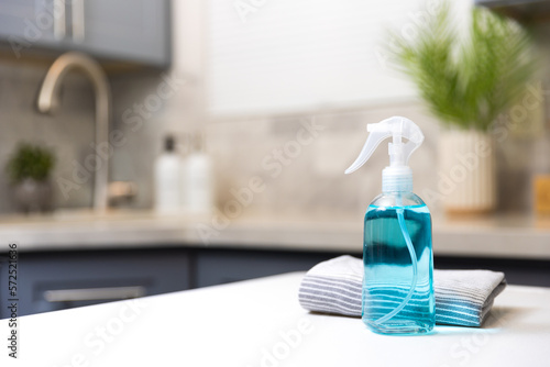 Cleaning  spray in a kitchen photo