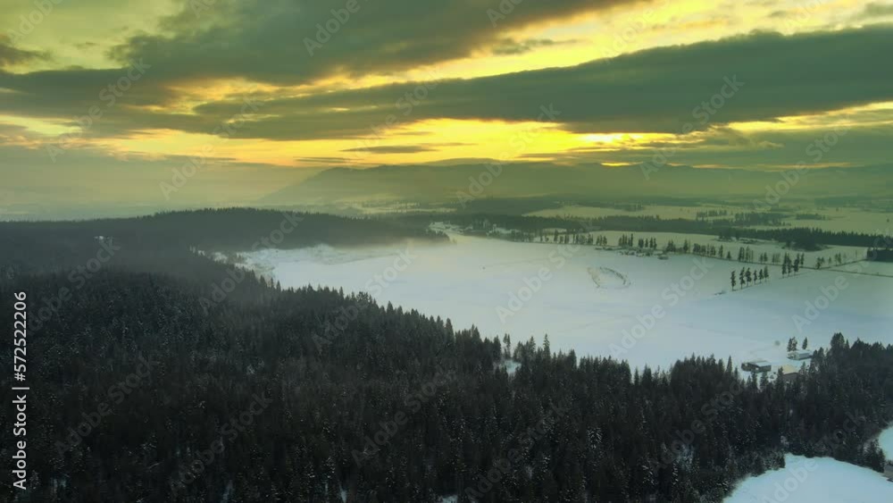 Winter Wonderland: Aerial View of Snow-Covered Farmland in Enderby, BC during sunset Winter Wonderland: Aerial View of Snow-Covered Farmland in Enderby, BC during sunset