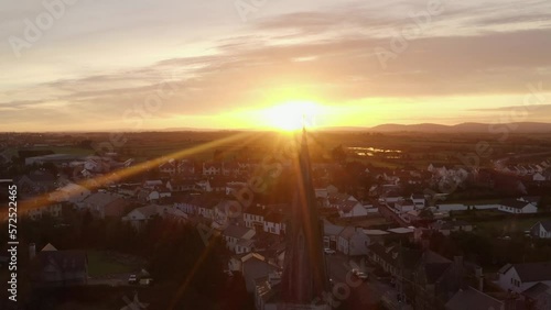 Cinematic aerial shot of Gort during sunset with Saint Colman's Church in the foreground. Galway, Ireland photo