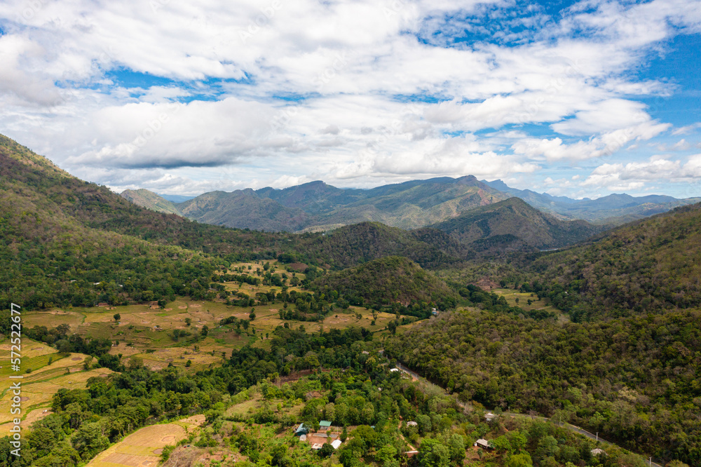 Aerial drone of Rice fields and terraces in a valley among the mountains. Agricultural landscape in Sri Lanka.