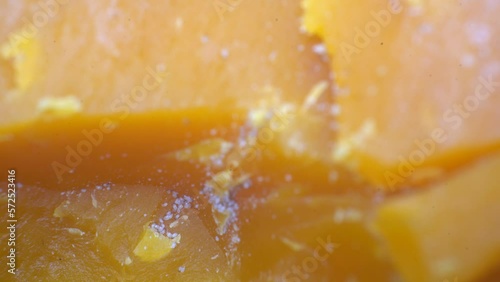 Macro Shot Of Orange Aged Cheese Mites Colony On Mimolette photo