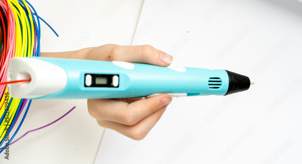 a boy draws a house with a 3d pen a boy draws a house with a 3d pen