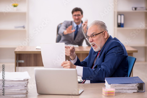 Two male colleagues sitting in the office