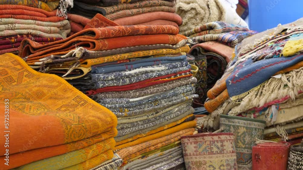 Piles of Persian carpets in a store Piles of Persian carpets in a store