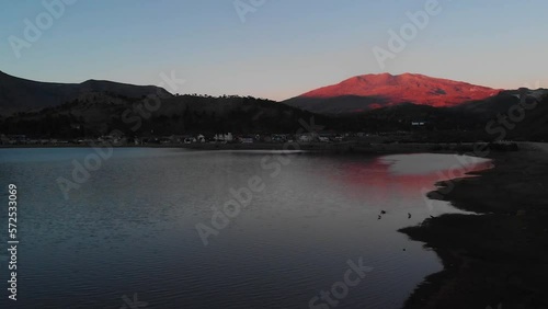 AERIAL - Sunset at Lake Agrio, Caviahue, Argentina Patagonia, slow motion forward photo