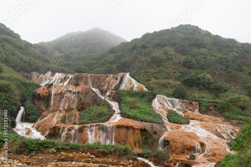 It is formed by the interaction of underground spring water with iron sulfide. Golden Waterfall, Jinguashih, New Taipei City, Taiwan. photo