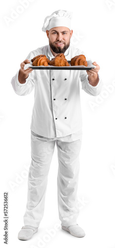 Male baker with tray of tas...