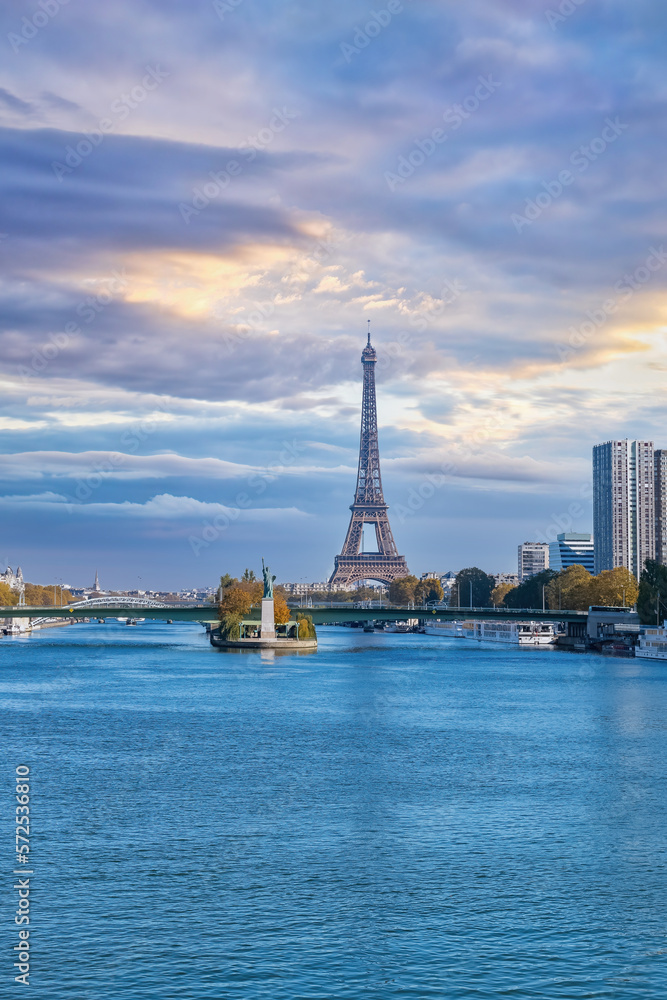Paris, the Grenelle bridge , with the liberty statue, and the Eiffel Tower in background.