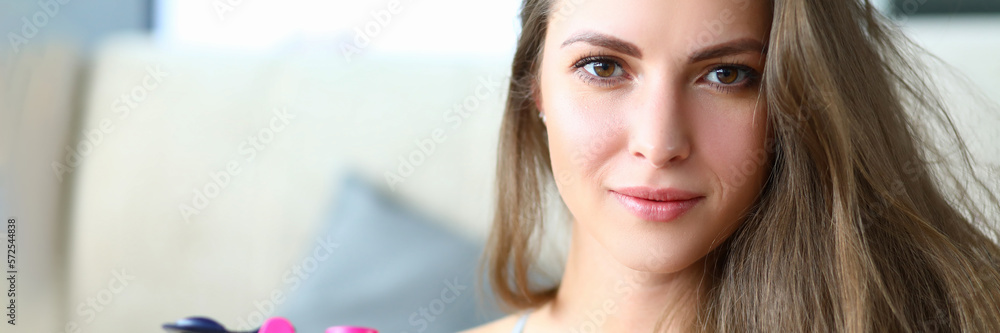 Obraz premium Portrait of beautiful strong happy young athletic woman with bottle of drinking water