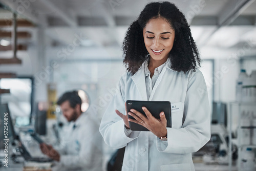 Foto Science, research and black woman with tablet, smile and internet in laboratory with medical data