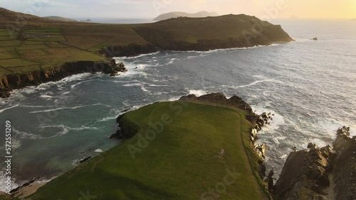 Breathtaking aerial footage captures the serene beauty of Ireland's Dingle Near the Great Blasket Islands on the Dingle Peninsula at Golden Hour. photo