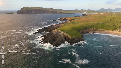 Breathtaking aerial footage captures the serene beauty of Ireland's Dingle Near the Great Blasket Islands on the Dingle Peninsula at Golden Hour. photo