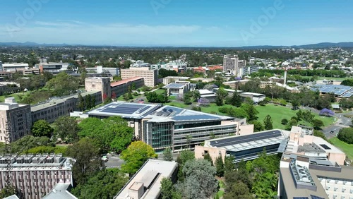 Drone shot of University of Queensland UQ St Lucia, drone orbiting UQ's Great Court and Forgan Smith Building. Shot during day time with clear blue skies. Brisbane QLD University 4K photo