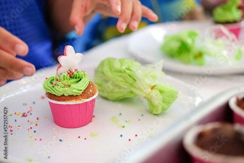 child making cupcakes