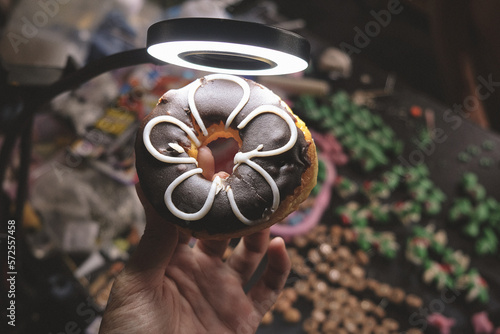 hand holding a donut