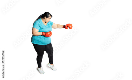 Angry Overweight indian woman wearing red boxing gloves punching isolated on white background, Plus size sporty asian female with fighting gesture.Copy space. Loose weight or weight loss Activity.