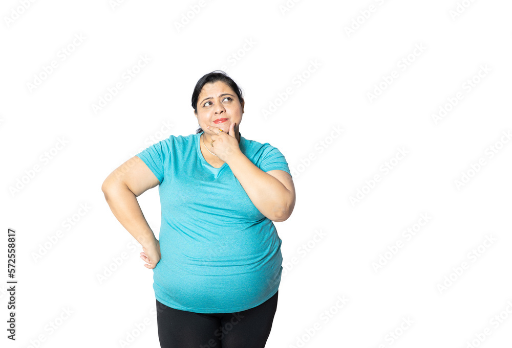 Overweight indian woman thinking of something isolated over white background, Copy space. Fat asian young girl wearing casual T-shirt . Obesity concept. Overweight indian woman thinking of something isolated over white background, Copy space. Fat asian young girl wearing casual T-shirt . Obesity concept.