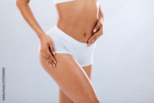 Body, beauty and black woman butt with fitness, health and skin glow aesthetic with hair removal. Isolated, white background and studio with model after cellulite, liposuction and cosmetic treatment photo