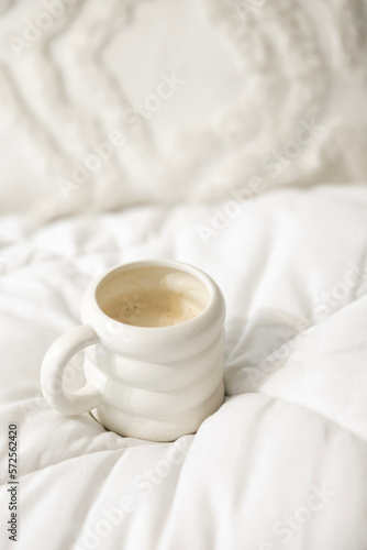 A cup of coffee in bed for breakfast