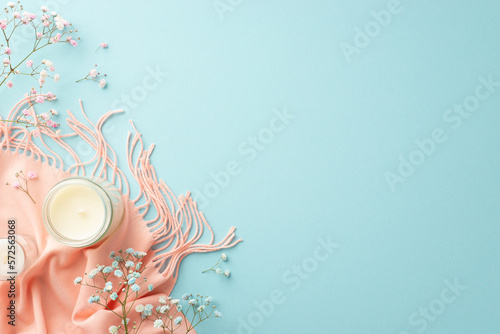Hello spring concept. Top view photo of candles gypsophila flowers and pink scarf on isolated pastel blue background with copyspace