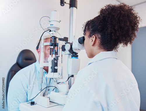 Photography Optometry, eye exam and ophthalmologist testing patient vision or eyes using a slit lamp machine by a doctor