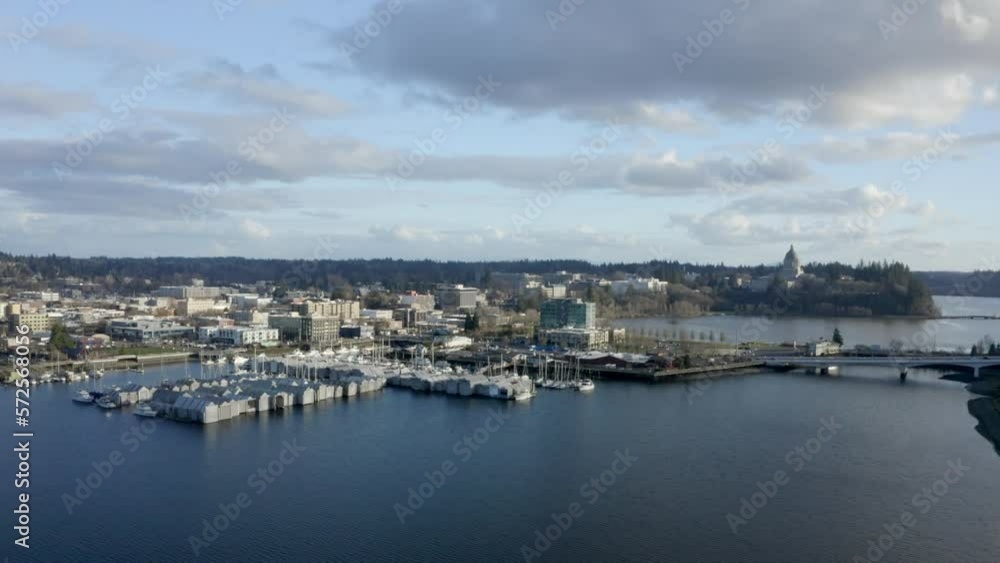 Drone of PNW capital city downtown with sail boats in marina. PNW waterways. Olympia Washington Puget Sound Drone of PNW capital city downtown with sail boats in marina. PNW waterways. Olympia Washington Puget Sound