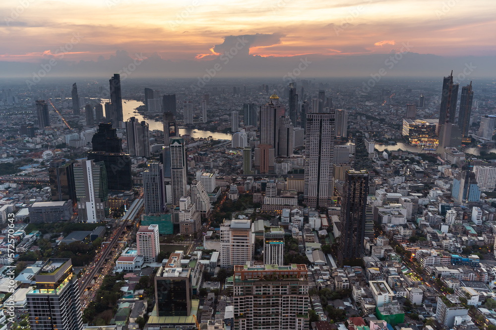 Obraz premium Bangkok cityscape top view and Chaophraya river in twilight time. Civilization city traveler and tourism destination with copy space.