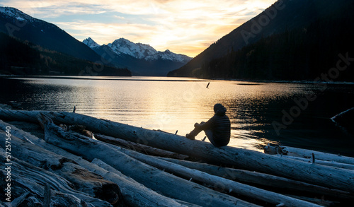 Man watching sunset atÂ DuffeyÂ Lake, Duffey Lake Provincial Park, British Columbia, Canada photo