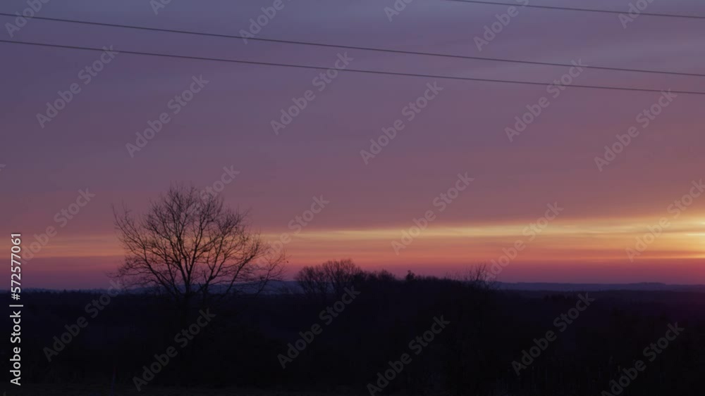 Medium shot of an electricity pylon at sunrise. (4K Resolution - Panning camera movement) Medium shot of an electricity pylon at sunrise. (4K Resolution - Panning camera movement)