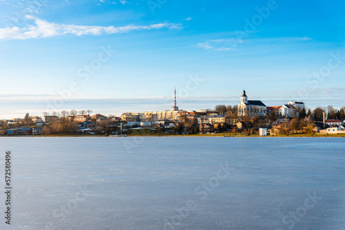 Telsiai town,ice lake in Lithuania. Nice view winter of colorful houses on coast of frozen Lake.Nice winter evening.Copy space.