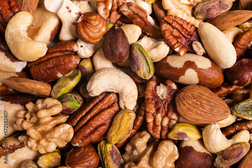 Print op canvas extreme close-up top view, a background with a large variety of shelled nuts