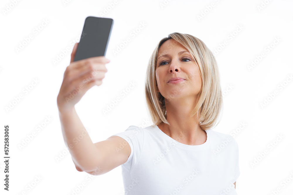 Picture of blonde woman over back isolated background with mobile phone Picture of blonde woman over back isolated background with mobile phone