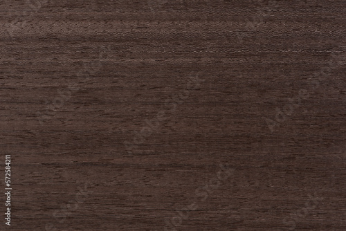 Texture of mahogany. Texture of koto wood with a reddish brown tint. Exotic rare wood from Africa for the production of expensive furniture or interior elements