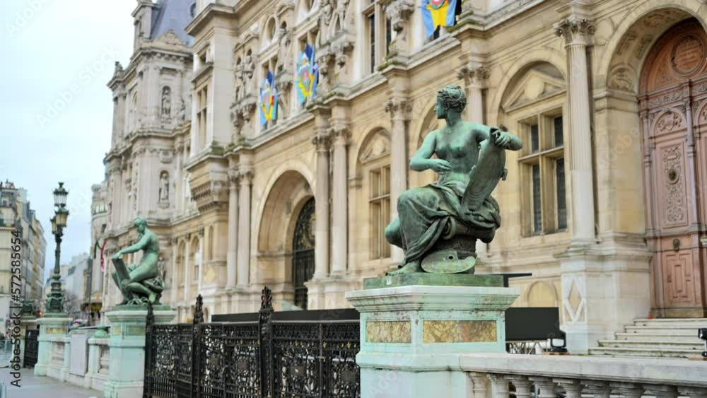 View of an old classic building exterior with emblems and antique lamppost in Paris, France View of an old classic building exterior with emblems and antique lamppost in Paris, France